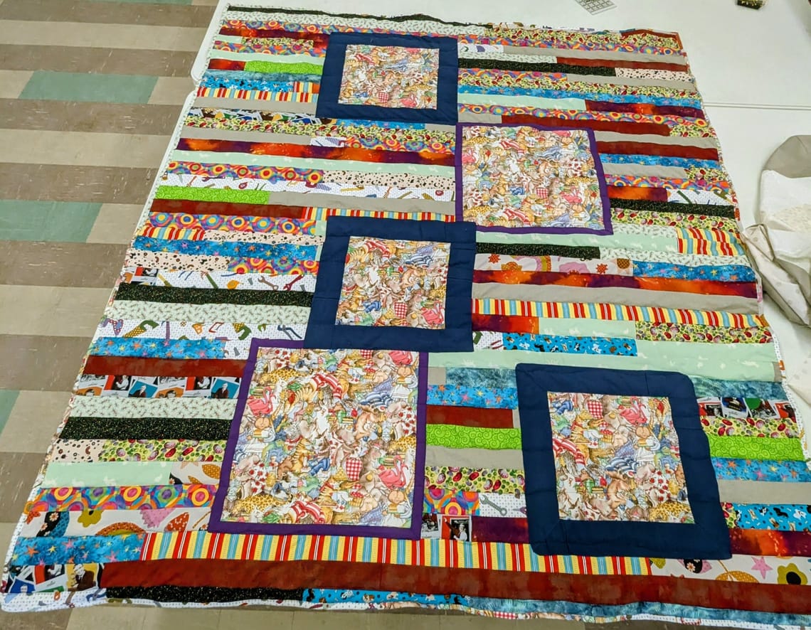 Donation quilt with framed squares